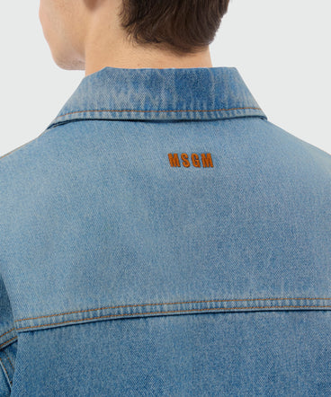 Light-wash denim short-sleeve shirt with localized distressing