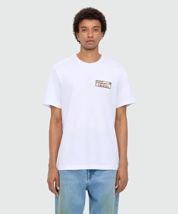 White long-sleeve cotton jersey T-shirt with patch on the chest.