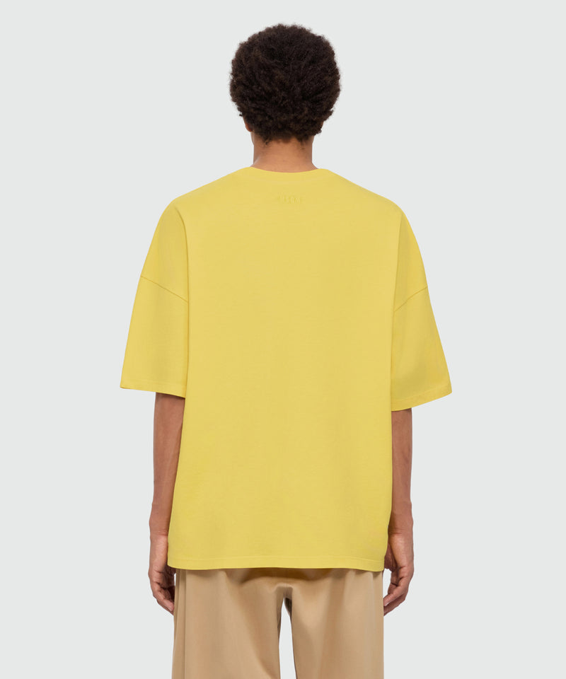 Yellow short-sleeve cotton jersey T-shirt with printed quote on the front 06 Uomo 