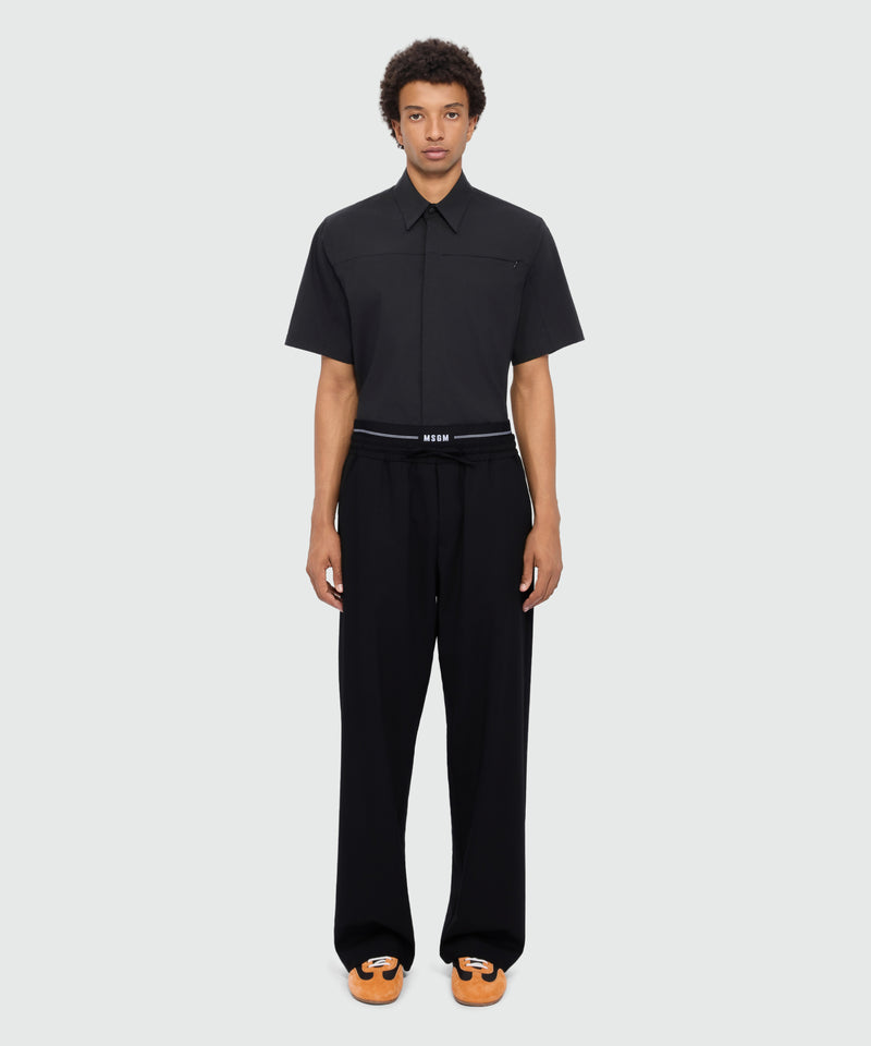 Black wool trousers with logo elasticated waistband 99 Uomo 