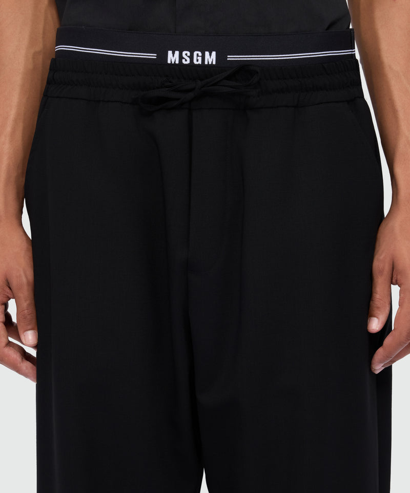 Black wool trousers with logo elasticated waistband 99 Uomo 