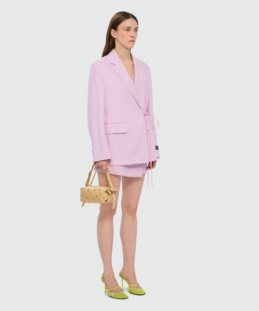 Pink viscose-blend canvas shorts with wrap closure and visible button