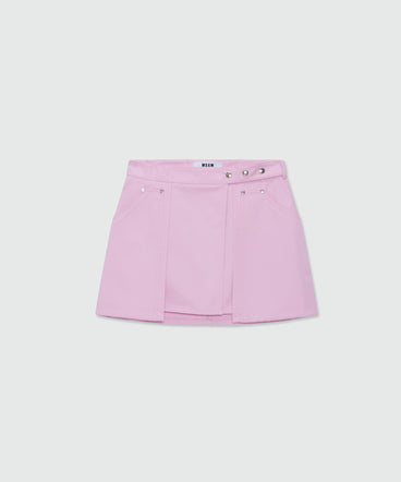 Pink cotton gabardine wrap miniskirt with metal buttons