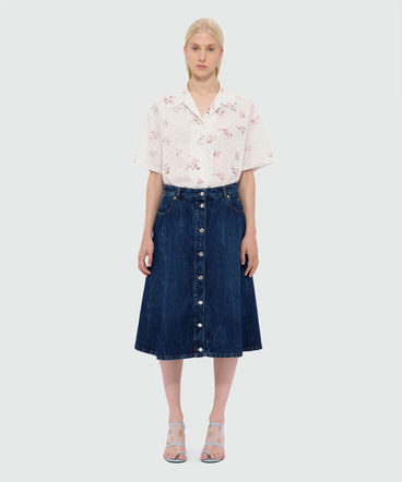 Raw denim skirt with front metal button fastening