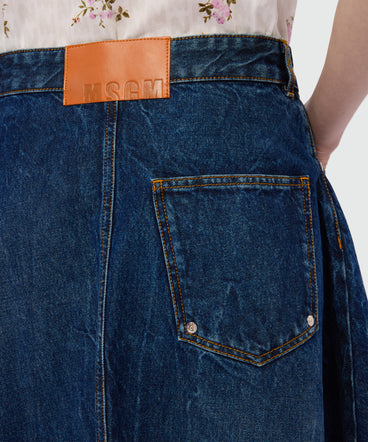 Raw denim skirt with front metal button fastening