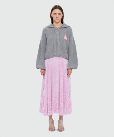 Pink pleated soleil skirt with all-over MWAVE logo print