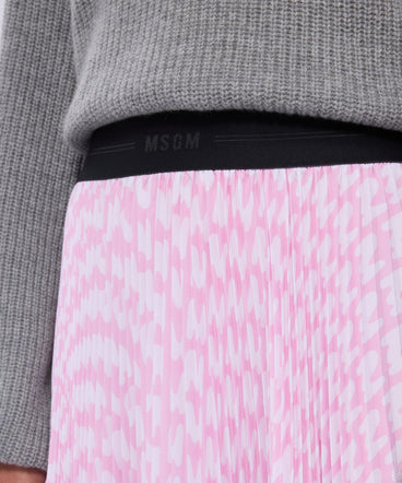 Pink pleated soleil skirt with all-over MWAVE logo print