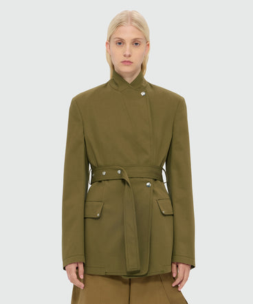 Military green double-breasted cotton gabardine jacket with belt and visible metal buttons