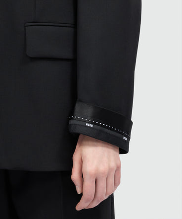 Black single-breasted lightweight wool jacket with two-button fastening and logo cuffs