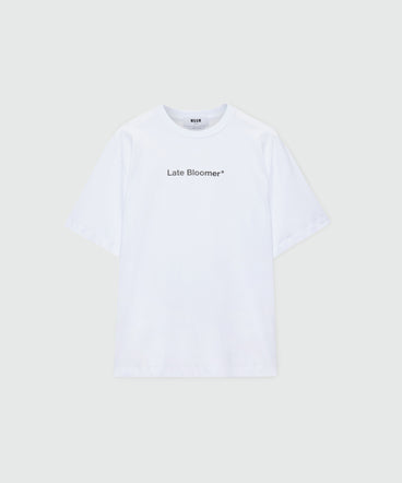 White short-sleeve cotton jersey T-shirt with "Late Bloomer" quote print on the front