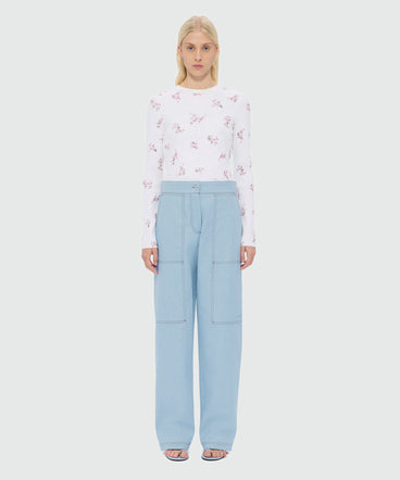 Oversized raw denim trousers with contrast stitching and metal rivets