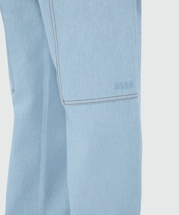 Oversized raw denim trousers with contrast stitching and metal rivets