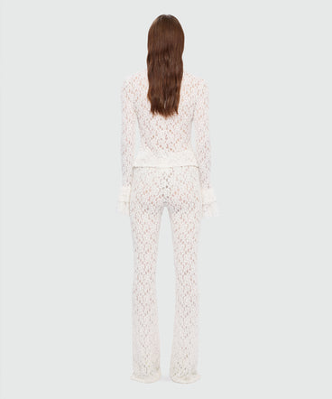 White flared stretch lace leggings with floral motif
