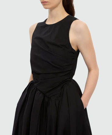 Black midi poplin dress with asymmetrical details.