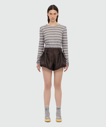 Brown jacquard shorts with python print.