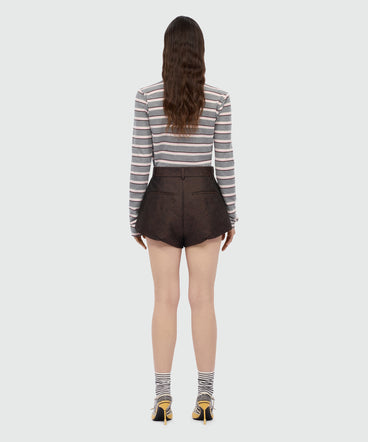 Brown jacquard shorts with python print.