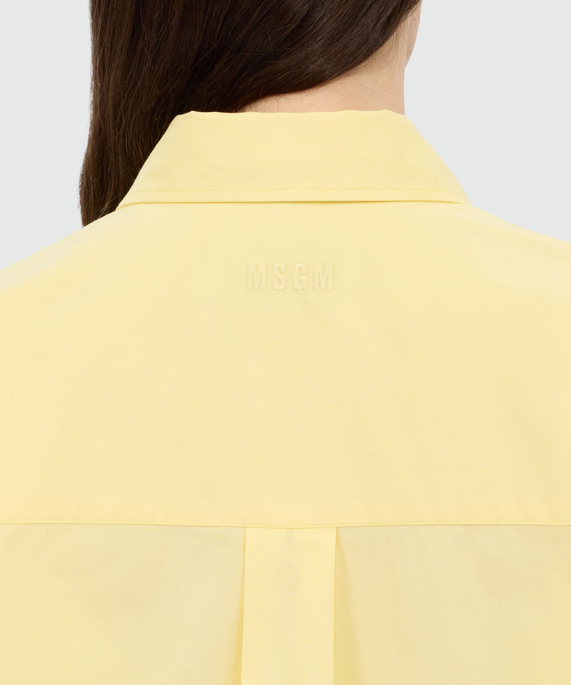 Yellow cotton poplin shirt with asymmetrical detail. 06 Donna 