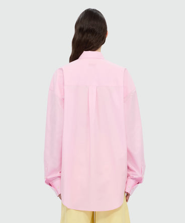 Pink cotton poplin shirt with studs.