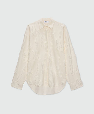 White fil coupe shirt with frayed details.