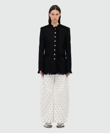 Black single-breasted raw cotton jacket with frayed edges.