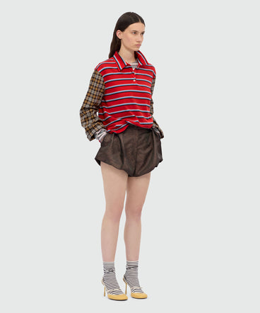 Polo patchwork in jersey a righe con maniche a contrasto