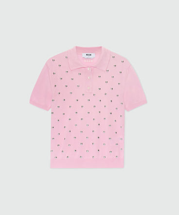 Pink knit polo with studs.