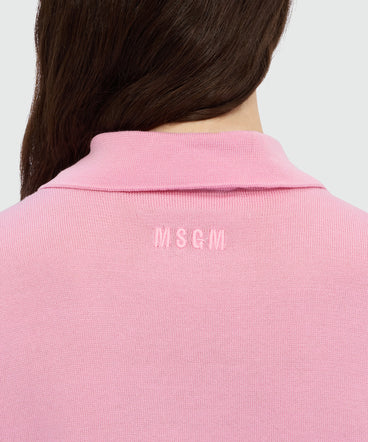 Pink knit polo with studs.