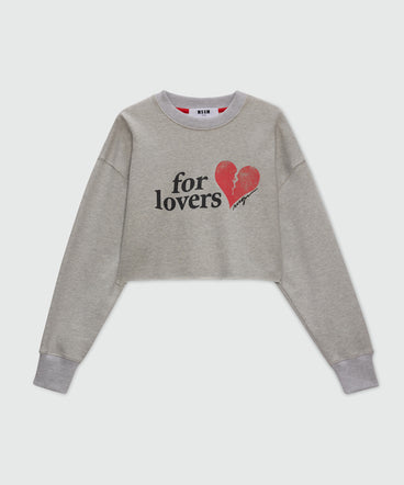 Grey cropped sweatshirt with "For Lovers" print and heart.