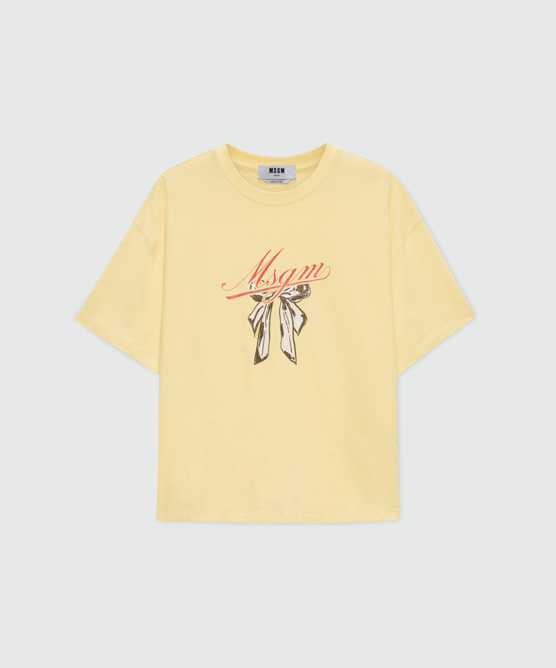 Yellow T-shirt with MSGM graphic print and bow. 04 Donna 