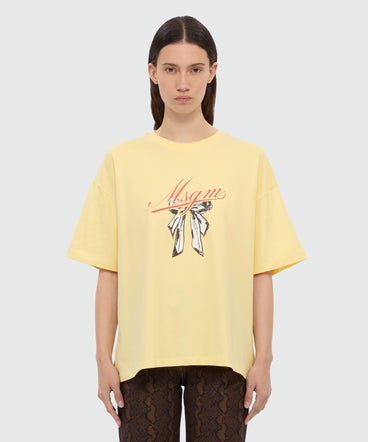 Yellow T-shirt with MSGM graphic print and bow.
