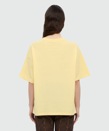 Yellow T-shirt with MSGM graphic print and bow.