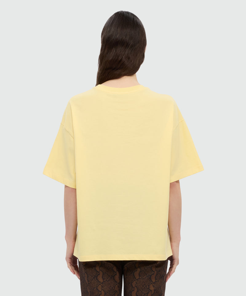 Yellow T-shirt with MSGM graphic print and bow. 04 Donna 