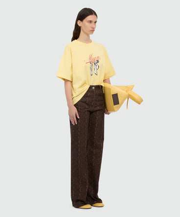 Yellow T-shirt with MSGM graphic print and bow.