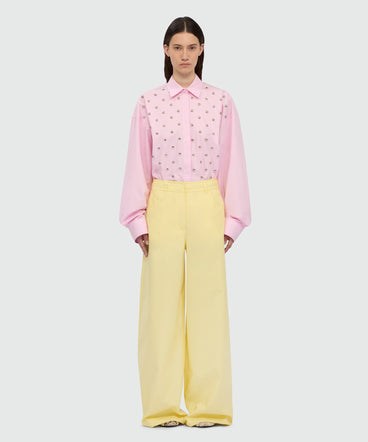 Yellow wide-leg cotton poplin trousers.