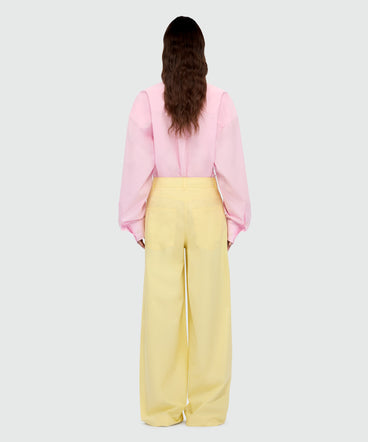 Yellow wide-leg cotton poplin trousers.
