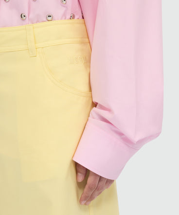 Yellow wide-leg cotton poplin trousers.