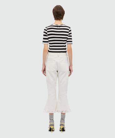 White frayed raw cotton flare Capri trousers.