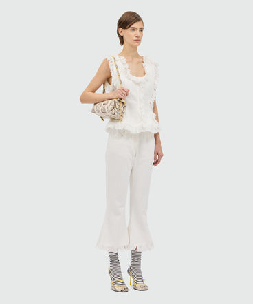 White frayed raw cotton flare Capri trousers.