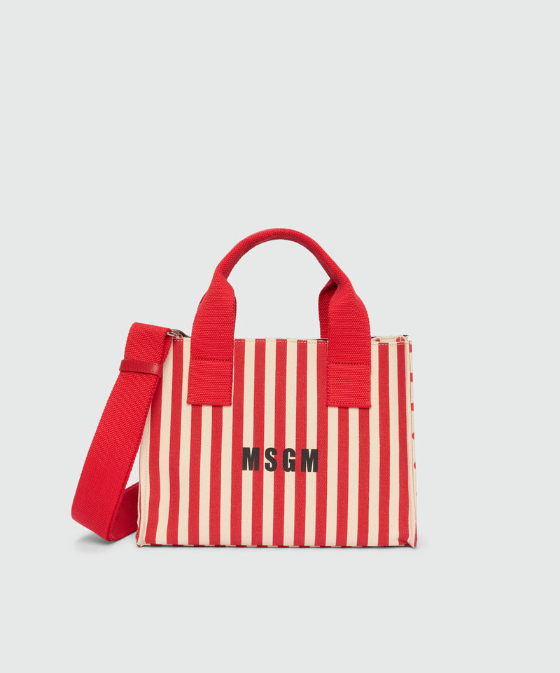 Small canvas tote with polka dot and stripe print. 18 Donna 