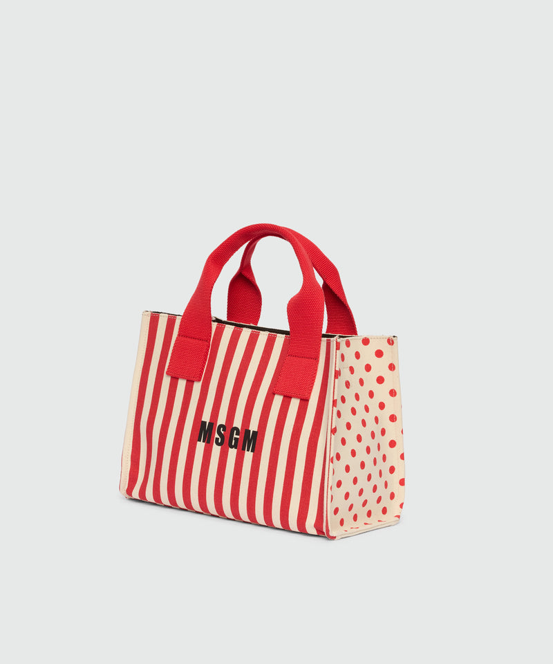 Small canvas tote with polka dot and stripe print. 18 Donna 