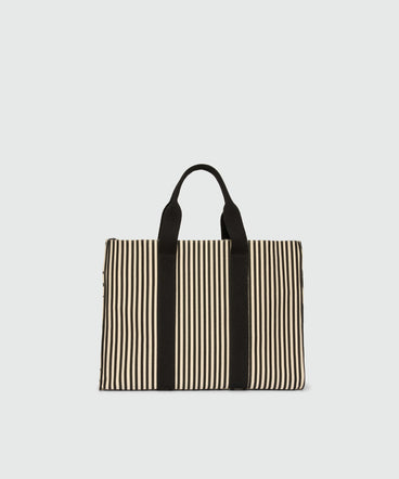 Horizontal canvas tote with polka dot print.