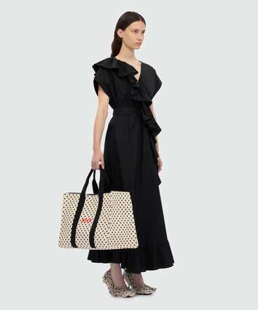 Horizontal canvas tote with polka dot print.