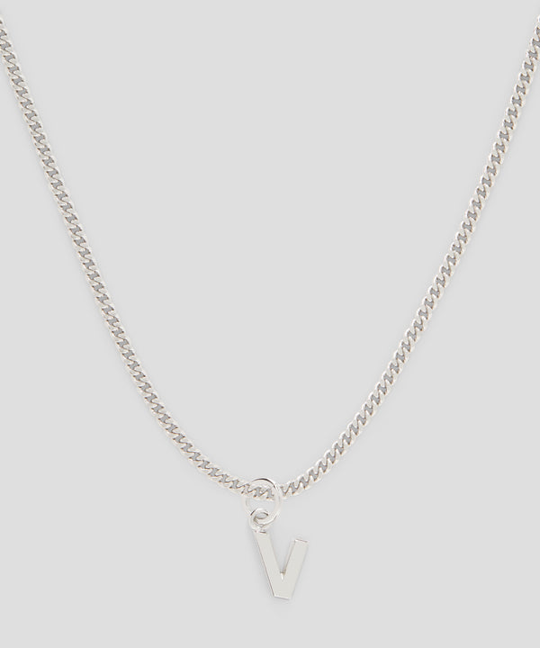 Brass letter V charm